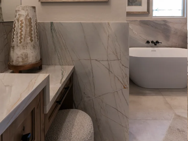 Overall view of the master bathroom showcasing layout and decor